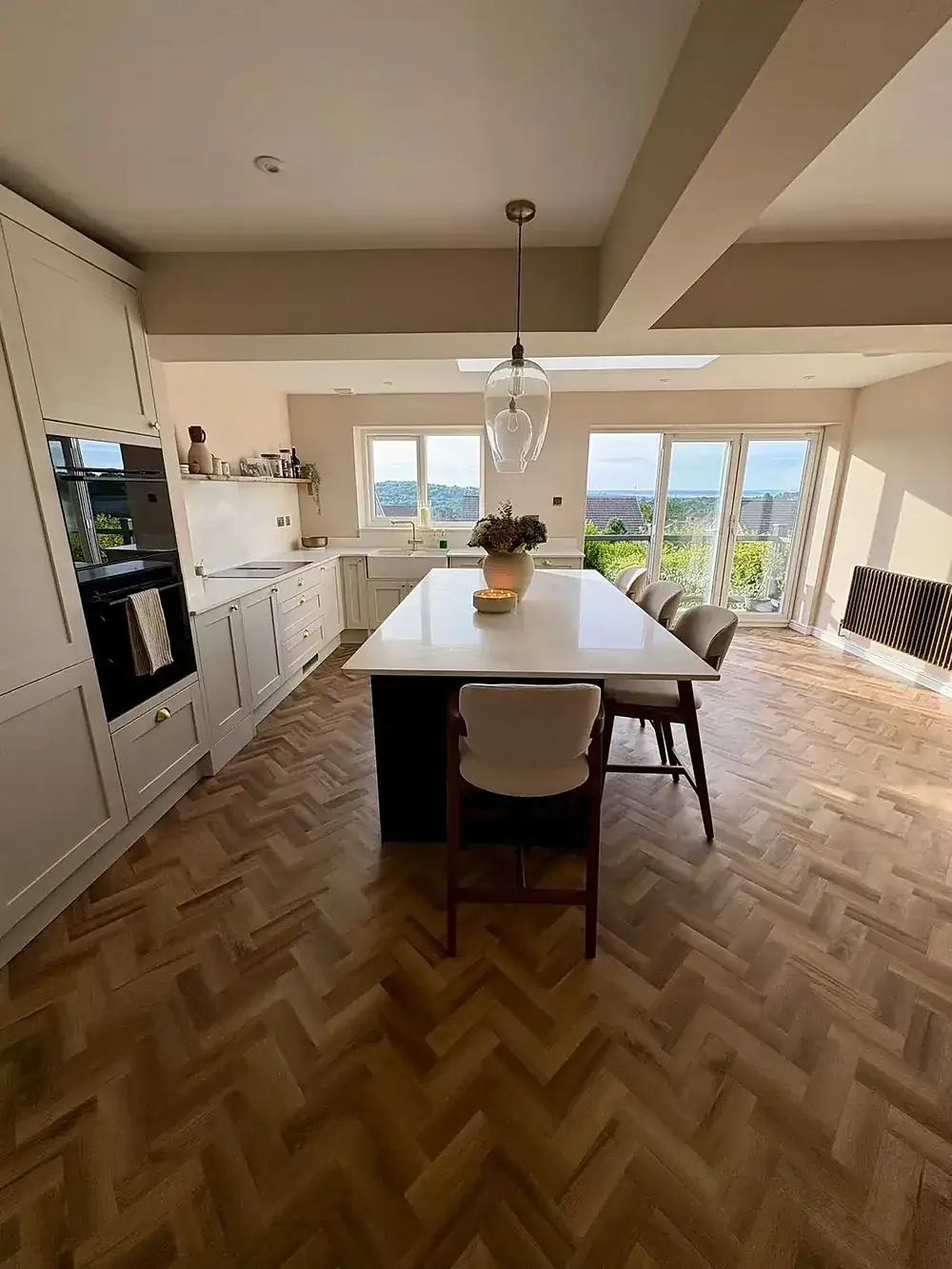 Open-plan kitchen and dining extension lit by a large rooflight